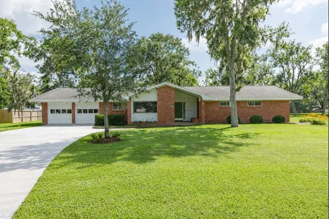 a front view of house with yard and seating area