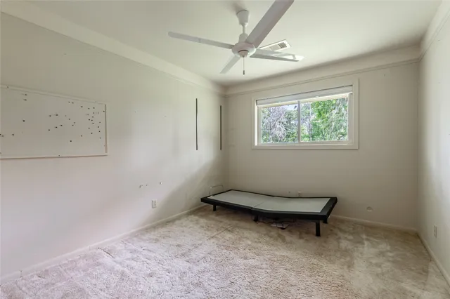 a view of a storage & utility room with dryer and washer