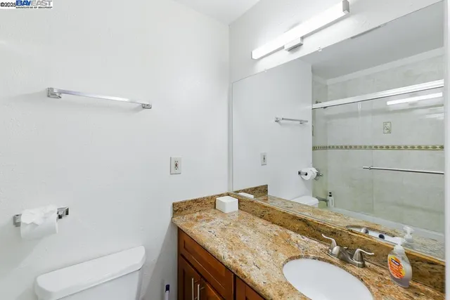 a bathroom with a shower and toilet