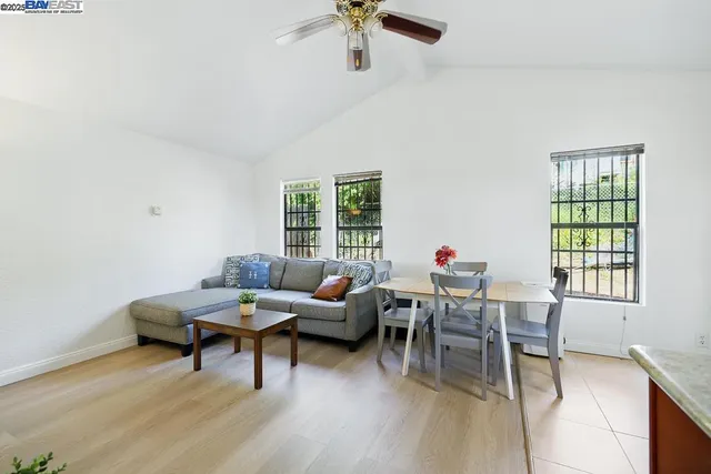 a view of a livingroom with furniture and a flat screen tv