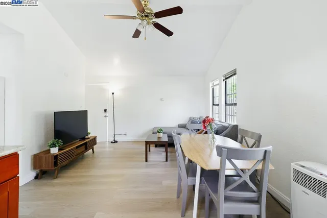 a dining room with furniture and window