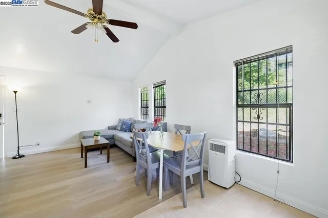 a bedroom with a bed and a lamp