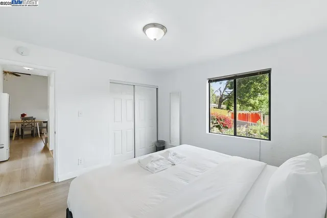 a spacious bathroom with a granite countertop sink and mirror