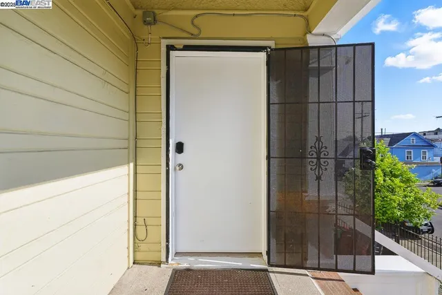 a view of a door and wooden floor