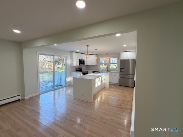 26 Kelly Road Hamden, CT 06518 - Photo 11 of 38 a large kitchen with a lot of counter top space and stainless steel appliances