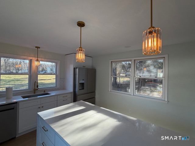 26 Kelly Road Hamden, CT 06518 - Photo 16 of 38 a kitchen with granite countertop a stove and a sink