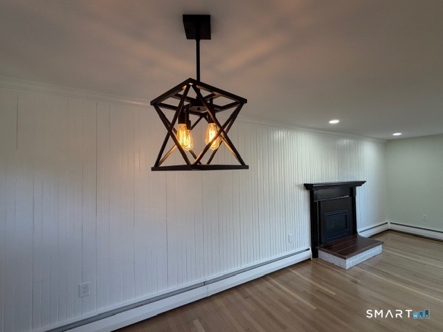 26 Kelly Road Hamden, CT 06518 - Photo 17 of 38 a view of a hallway with wooden floor and chandelier