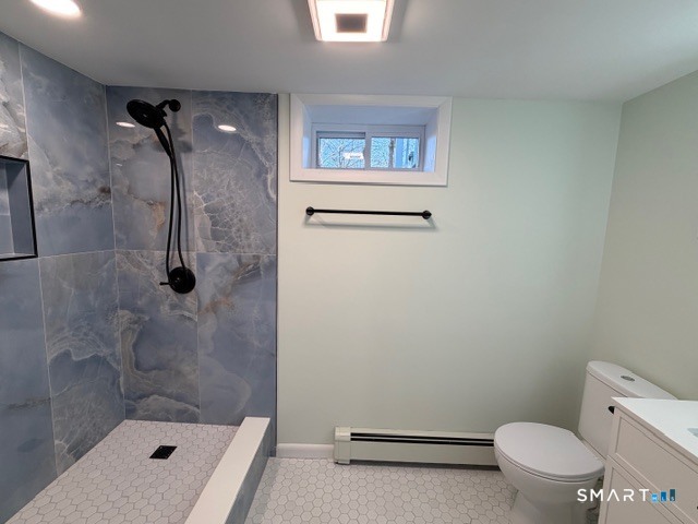 26 Kelly Road Hamden, CT 06518 - Photo 32 of 38 a bathroom with a toilet and a shower