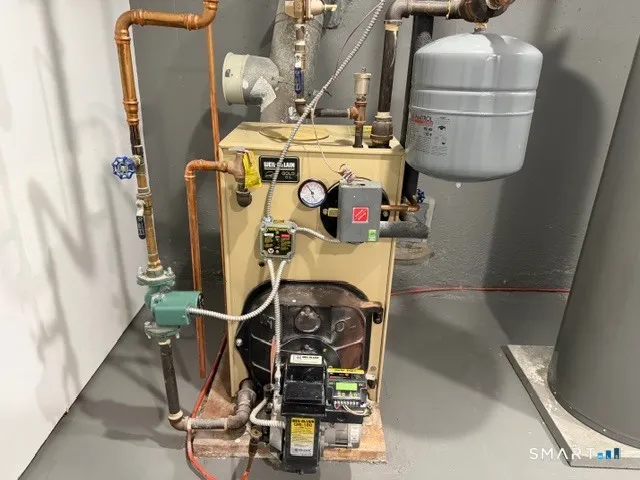 a utility room with dryer washer and other items