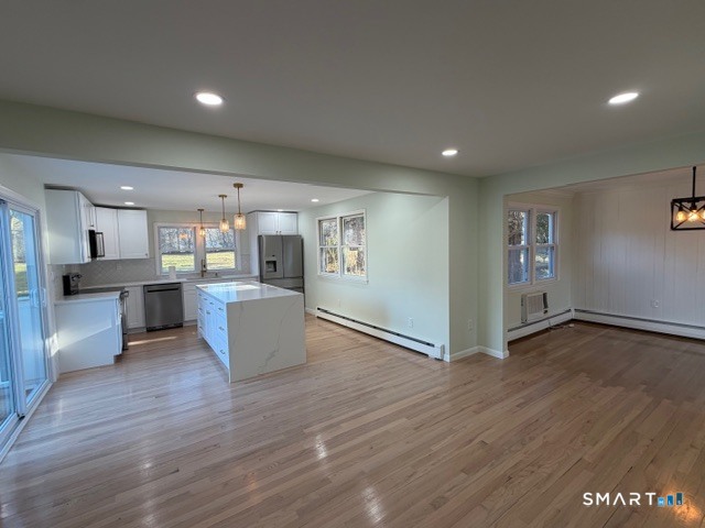 26 Kelly Road Hamden, CT 06518 - Photo 10 of 38 a view of kitchen with cabinets and wooden floor