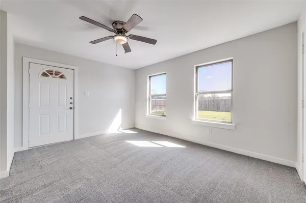 a view of an empty room with a window