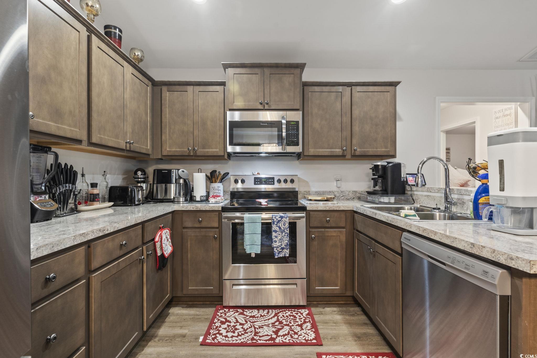 3500 Church Street Loris, SC 29569 - Photo 15 of 30 Kitchen with light wood finished floors, stainless