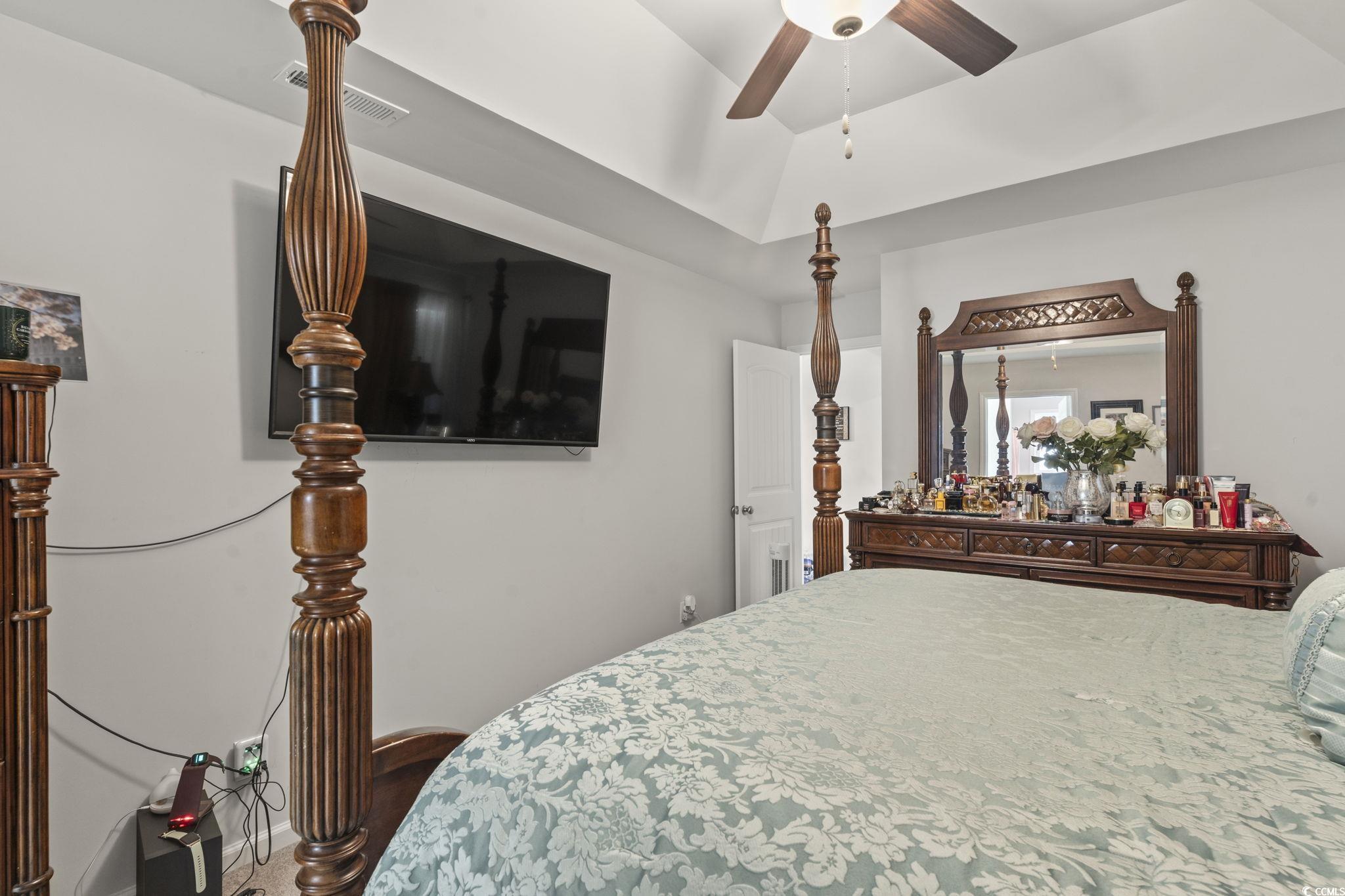 3500 Church Street Loris, SC 29569 - Photo 19 of 30 Bedroom with lofted ceiling, visible vents, and a