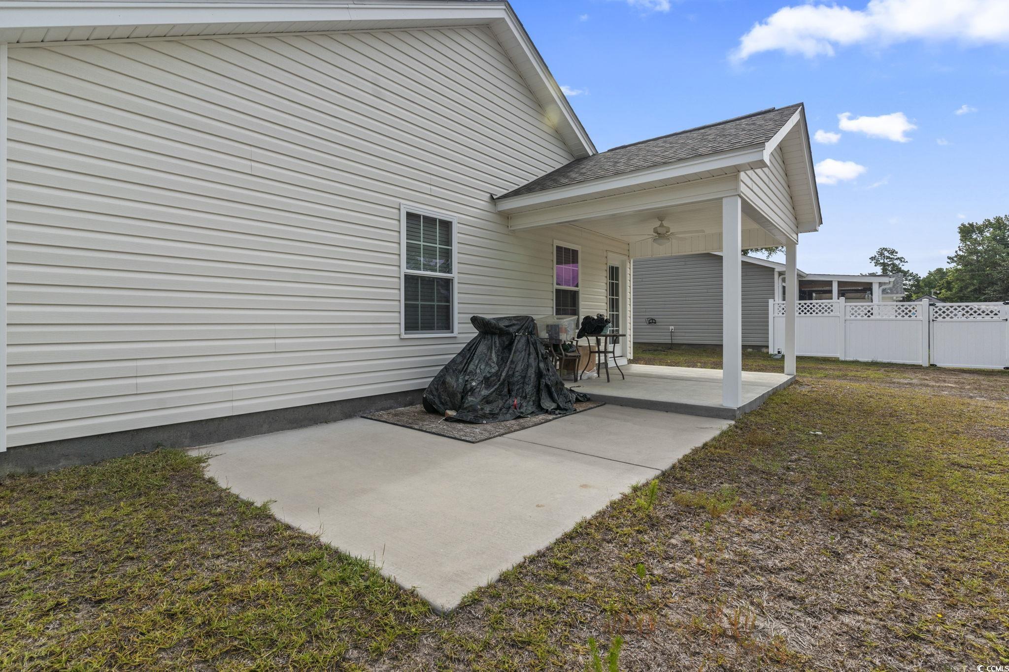 3500 Church Street Loris, SC 29569 - Photo 24 of 30 Back of property featuring a shingled roof, a pati