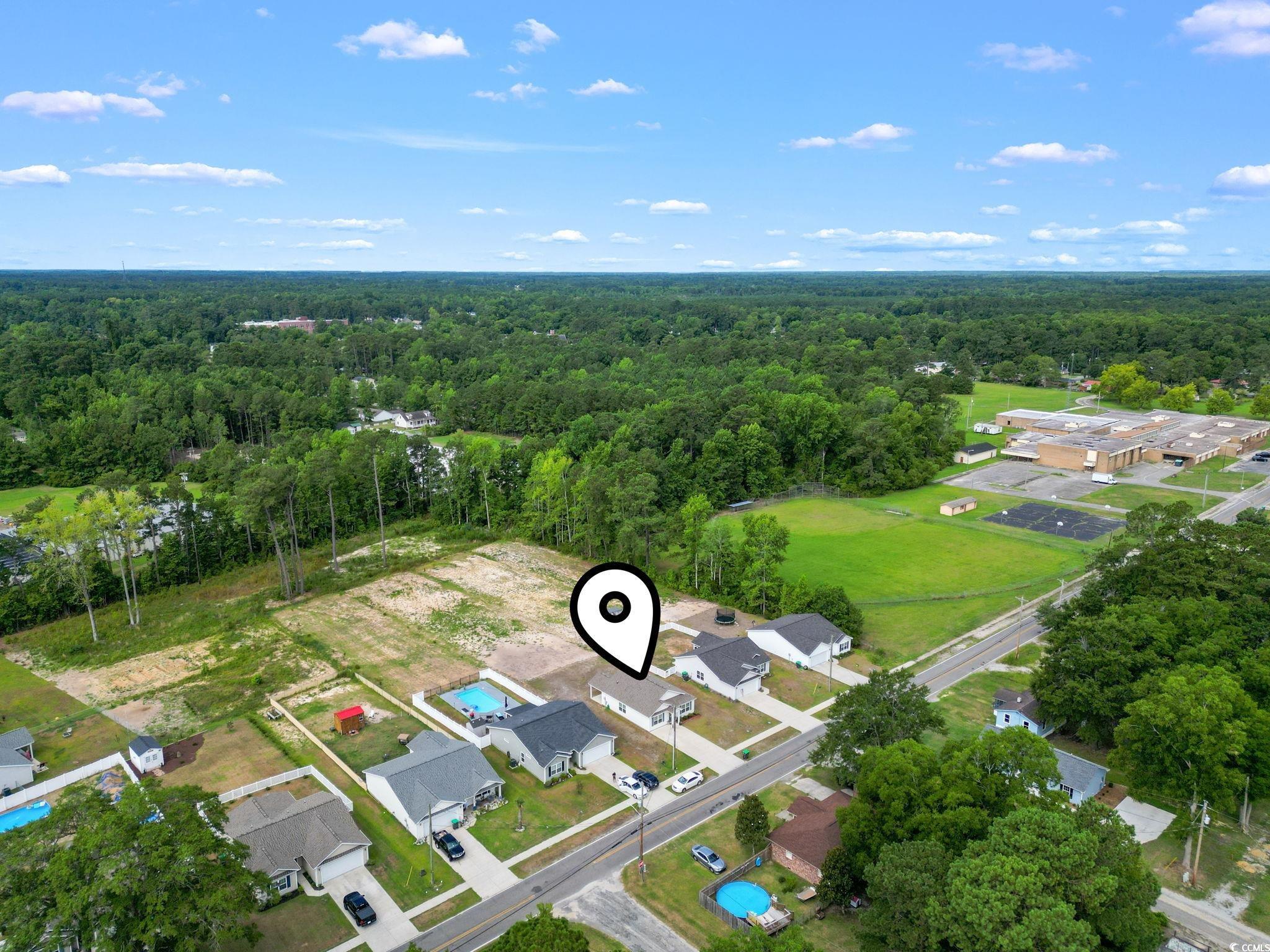 3500 Church Street Loris, SC 29569 - Photo 28 of 30 Birds eye view of property with a wooded view