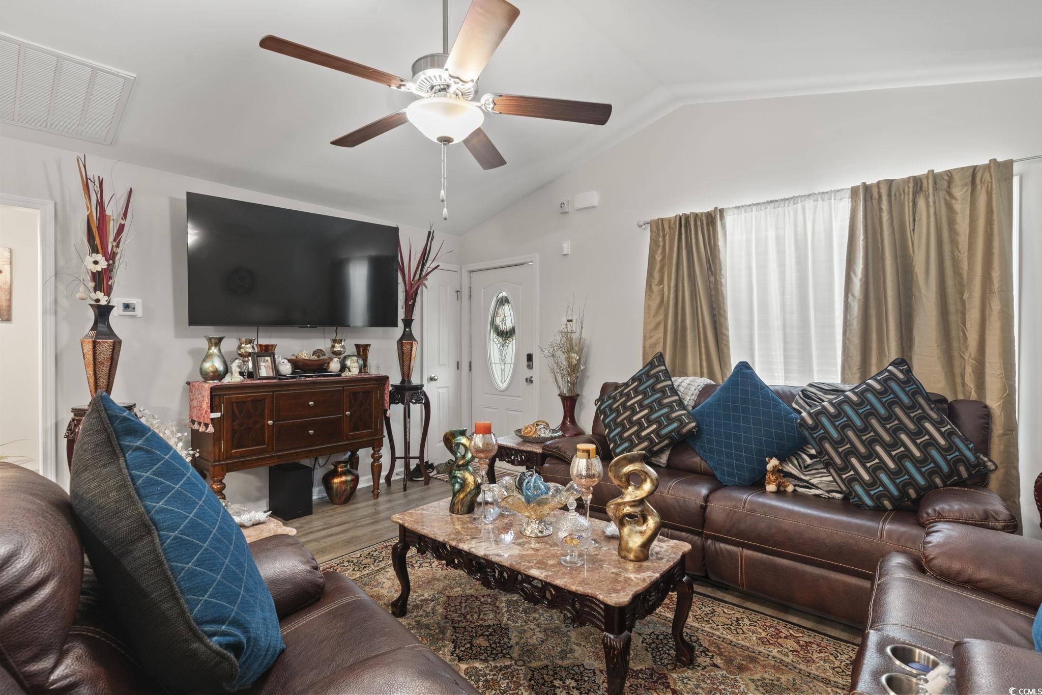 3500 Church Street Loris, SC 29569 - Photo 8 of 30 Living area featuring lofted ceiling, ceiling fan,