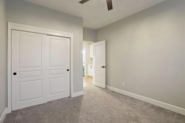 a bathroom with double vanity sink a mirror and shower