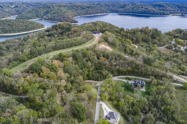 an aerial view of residential house with outdoor space and parking