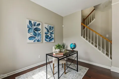 a view of a hallway with paintings on the wall