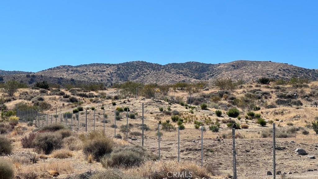 7300 East Mt Emma Road Littlerock, CA 93543 - Photo 1 of 33 a view of a dry field with mountains in the background
