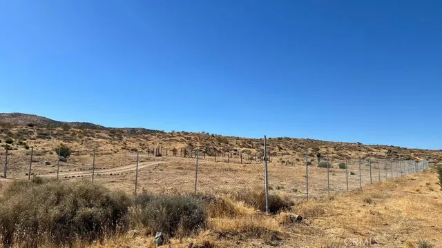 a view of a lake with mountains in the background