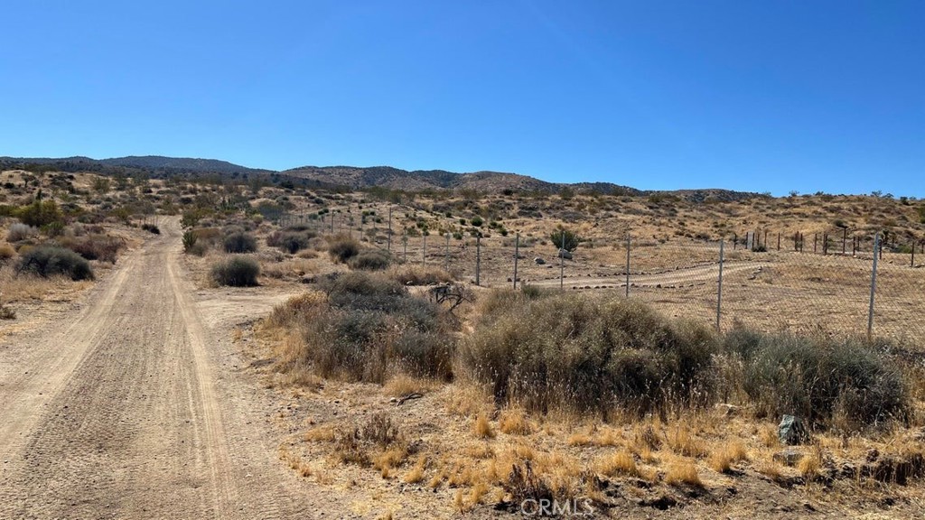 7300 East Mt Emma Road Littlerock, CA 93543 - Photo 13 of 33 a view of a lake with mountains in the background