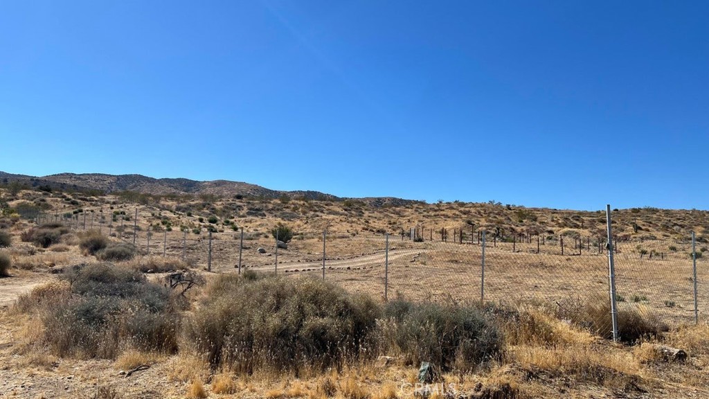 7300 East Mt Emma Road Littlerock, CA 93543 - Photo 14 of 33 a view of a lake with mountains in the background