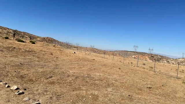 a view of a beach with a mountain