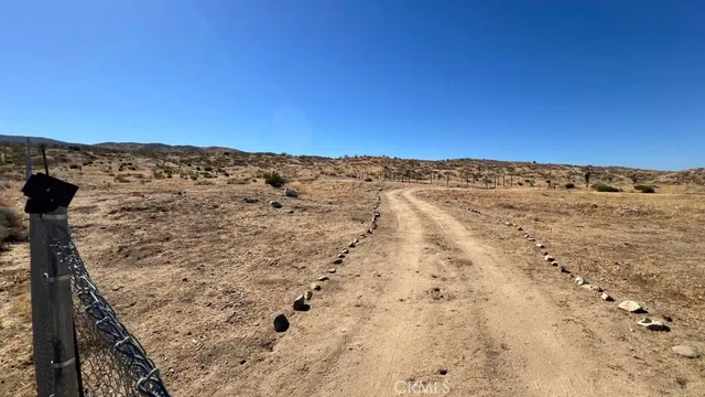 a view of a mountain range with trees