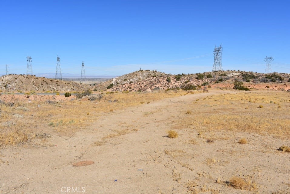 7300 East Mt Emma Road Littlerock, CA 93543 - Photo 6 of 33 a view of a dry yard with snow in the background