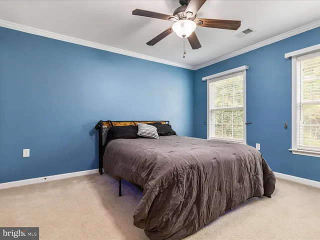 a kitchen with stainless steel appliances kitchen island granite countertop a refrigerator and microwave