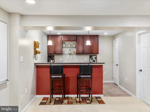 a view of a wooden bench and chairs
