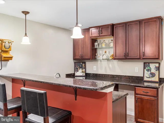 a view of a patio with a table and chairs
