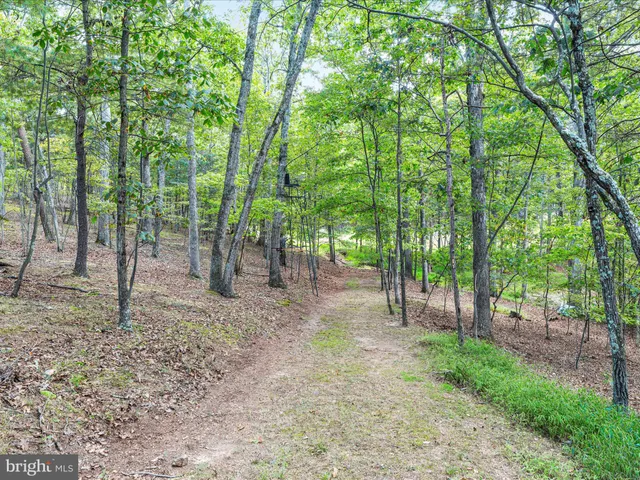 an aerial view of residential houses and outdoor space