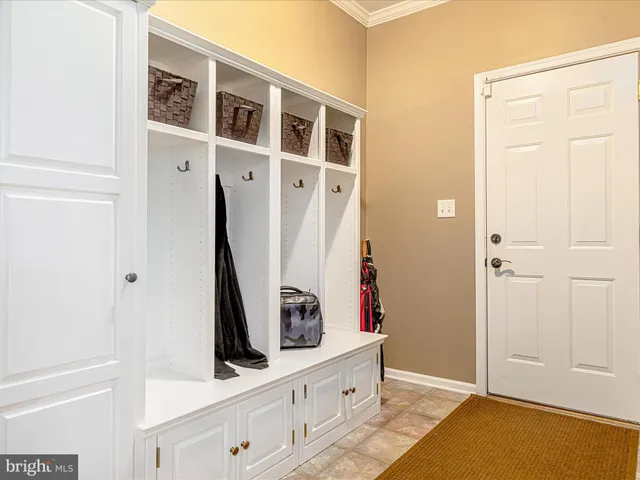 a living room with furniture a fireplace and a large window