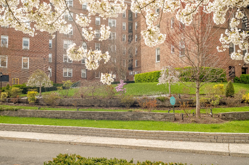 5645 Netherland Avenue, Unit 2F Bronx, NY 10471 - Photo 12 of 12 a view of a yard in front of a building
