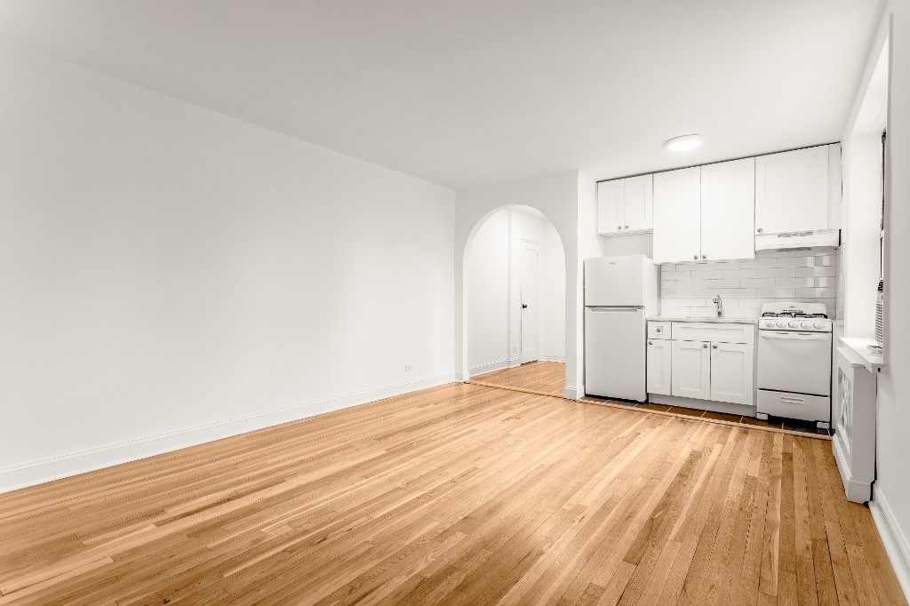 5645 Netherland Avenue, Unit 2F Bronx, NY 10471 - Photo 5 of 12 a view of a kitchen with wooden floor and a sink