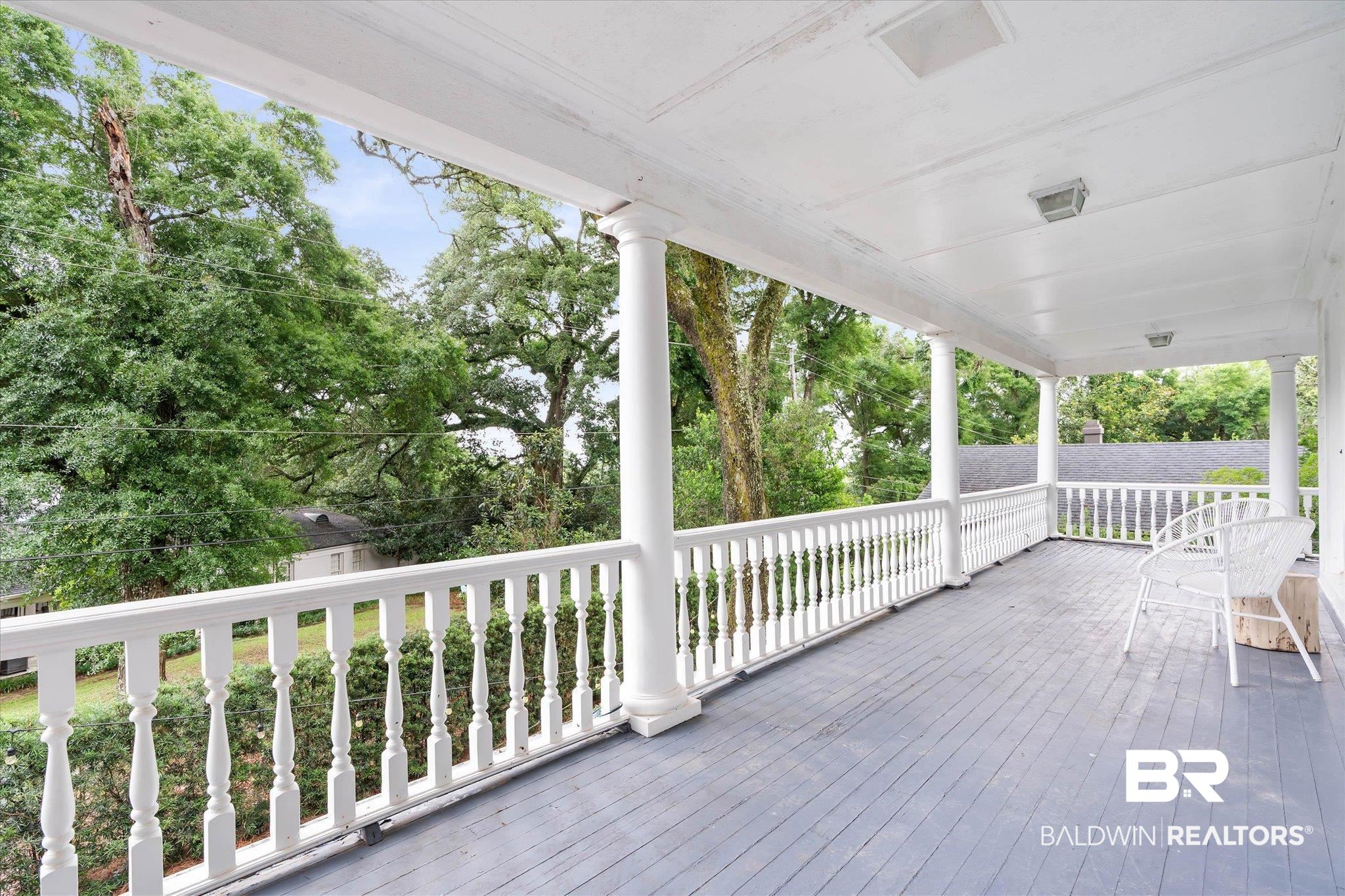 3908 Yester Place Mobile, AL 36608 - Photo 27 of 45 Spacious covered porch with painted wood flooring and white spindle railing