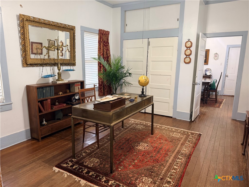 607 North Bridge Street Victoria, TX 77901 - Photo 5 of 8 a view of a workspace with furniture and wooden floor