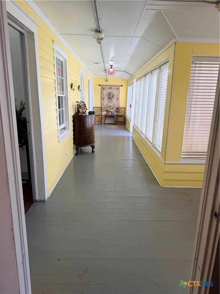 607 North Bridge Street Victoria, TX 77901 - Photo 6 of 8 a view of hallway with furniture and a window