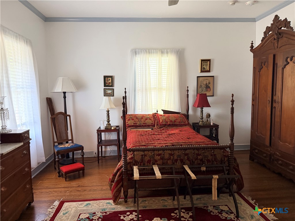 607 North Bridge Street Victoria, TX 77901 - Photo 7 of 8 a bedroom with furniture and a window