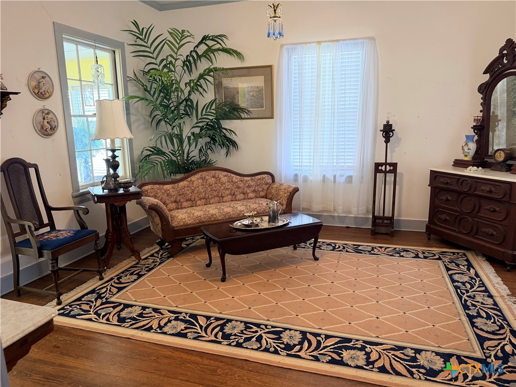 607 North Bridge Street Victoria, TX 77901 - Photo 8 of 8 a living room with furniture and a table