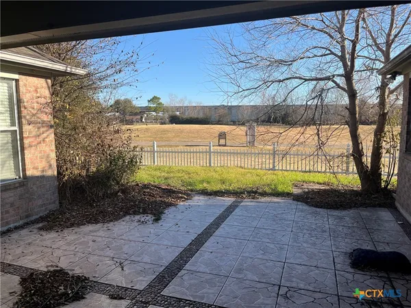 a view of backyard with green space