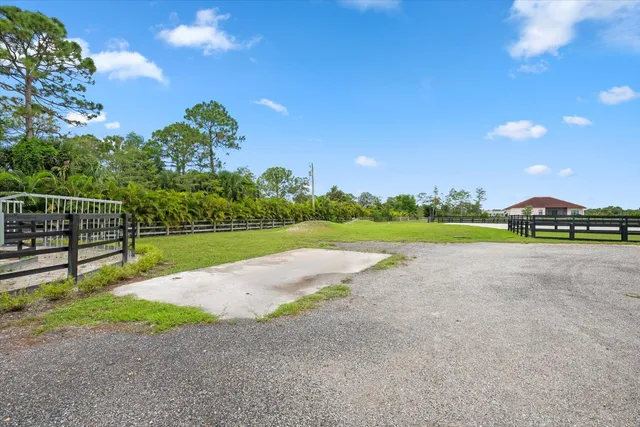 a view of outdoor space with deck and yard