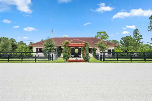 an aerial view of swimming pool with a yard