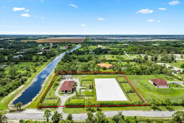a view of a swimming pool with a yard