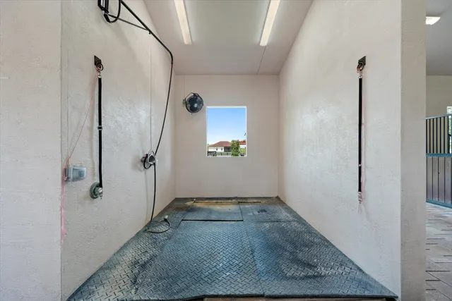 a view of a hallway with white walls