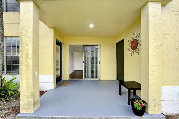 an entrance to house with yard