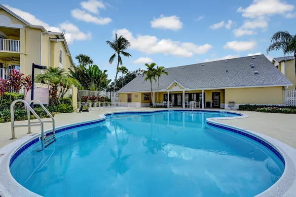 a view of swimming pool with outdoor seating