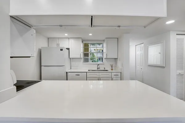 a kitchen with sink and window